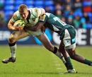 Northampton's Scott Armstrong is tackled by London Irish's Topsy Ojo