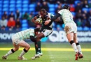 London Irish's Topsy Ojo is shackled by the Northampton defence