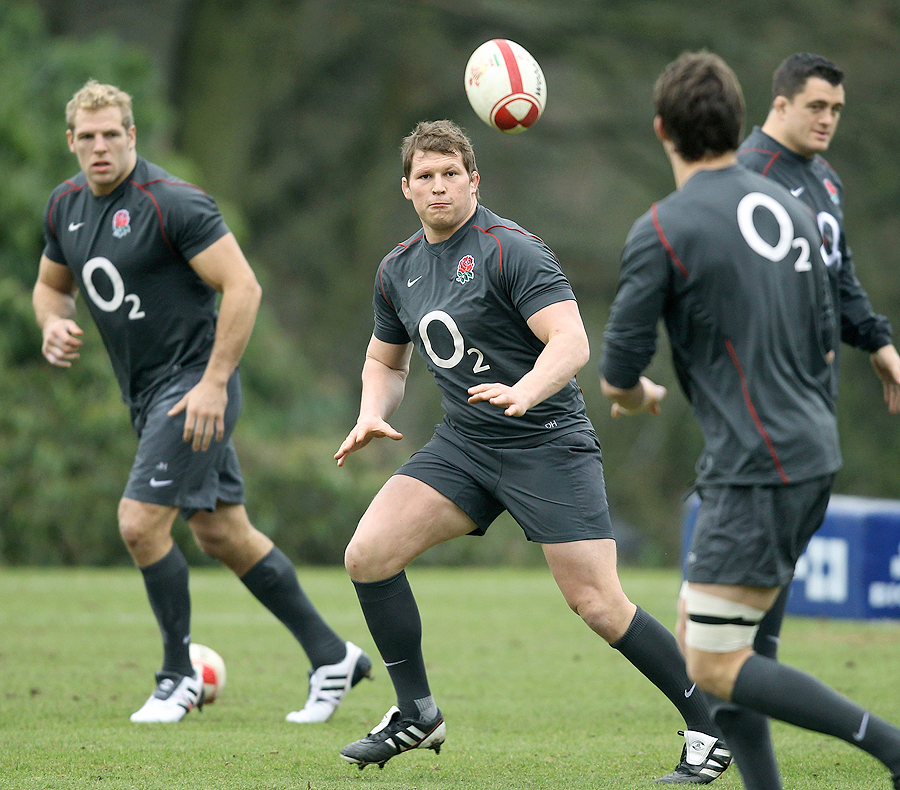 Dylan Hartley receives a pass at an England training session