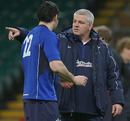 Wales coach Warren Gatland chats with fly-half Stephen Jones at training