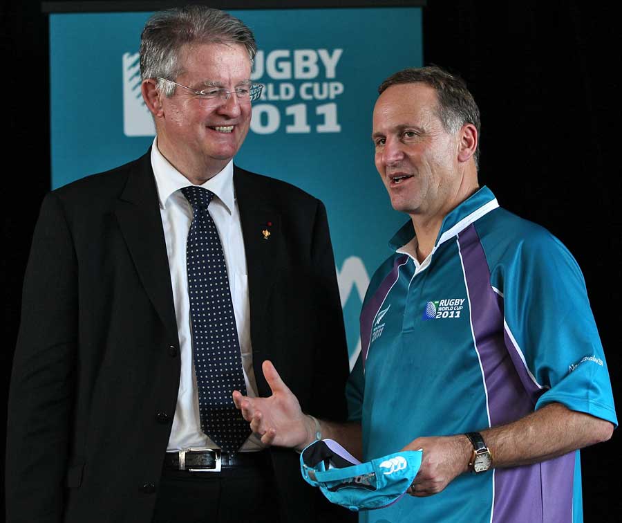 New Zealand Prime Minister John Key (R) speaks with IRB chairman Bernard Lapasset