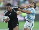 Frank Halai fends off Argentina's Ramiro Moyano during New Zealand's 34-7 win