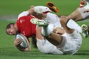 Wales' Ifan Evans is tackled by England's Chris Cracknell