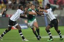 Frankie Horne of South Africa attempts to break through the Fiji defence