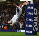 England's Chris Ashton dives over the line for the opening try