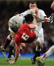 England's Tom Palmer tackles Wales' Dan Lydiate
