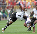 Fiji's Seremaia Burotu twists as he tackles Samoa's Afa Aiono