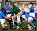 Ireland's Paul O'Connell is shackled by the Italy defence