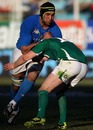 Italy's Quintin Geldenhuys charges into an Irish tackle