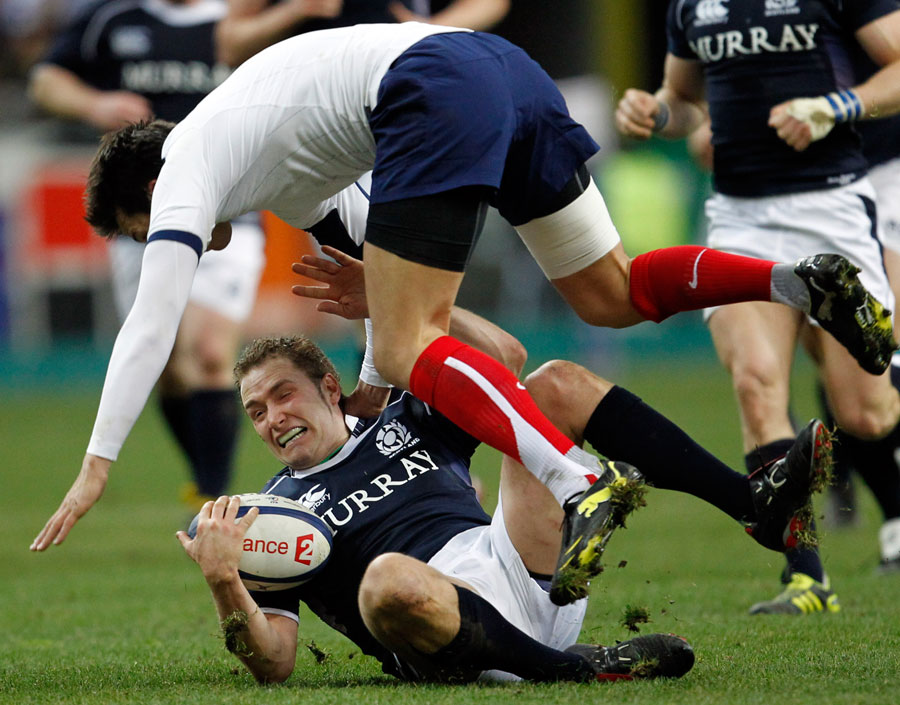 Scotland fly-half Dan Parks clashes with opposite number Francois Trinh-Duc