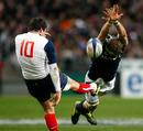 France's Francois Trinh-Duc clears under pressure from John Barclay