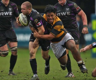 The Ospreys' Tom Isaacs is tackled by Wasps' Billy Vunipola, Ospreys v Wasps, Anglo-Welsh Cup, Brewery Field, Bridgend, Wales, February 6, 2011