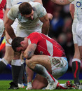 Wales centre Jamie Roberts is consoled by Joe Worsley