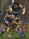 Sale's Andy Tuilagi is held by the Bath defence

