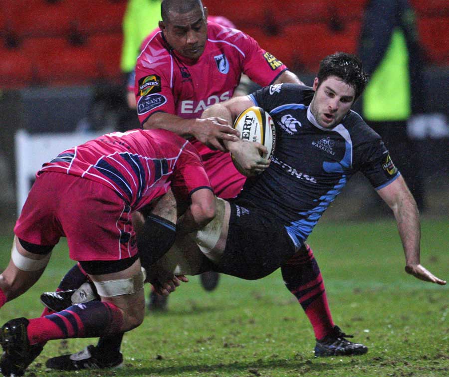 Glasgow's Johnnie Beattie iis felled by the Cardiff Blues defence