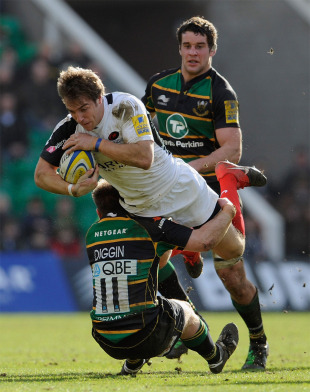 Saracens wing Chris Wyles is upended by Paul Diggin