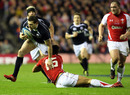 Scotland's Sean Lamont tries to get away from Lee Byrne