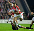 Wales centre Jamie Roberts is felled by Dan Parks