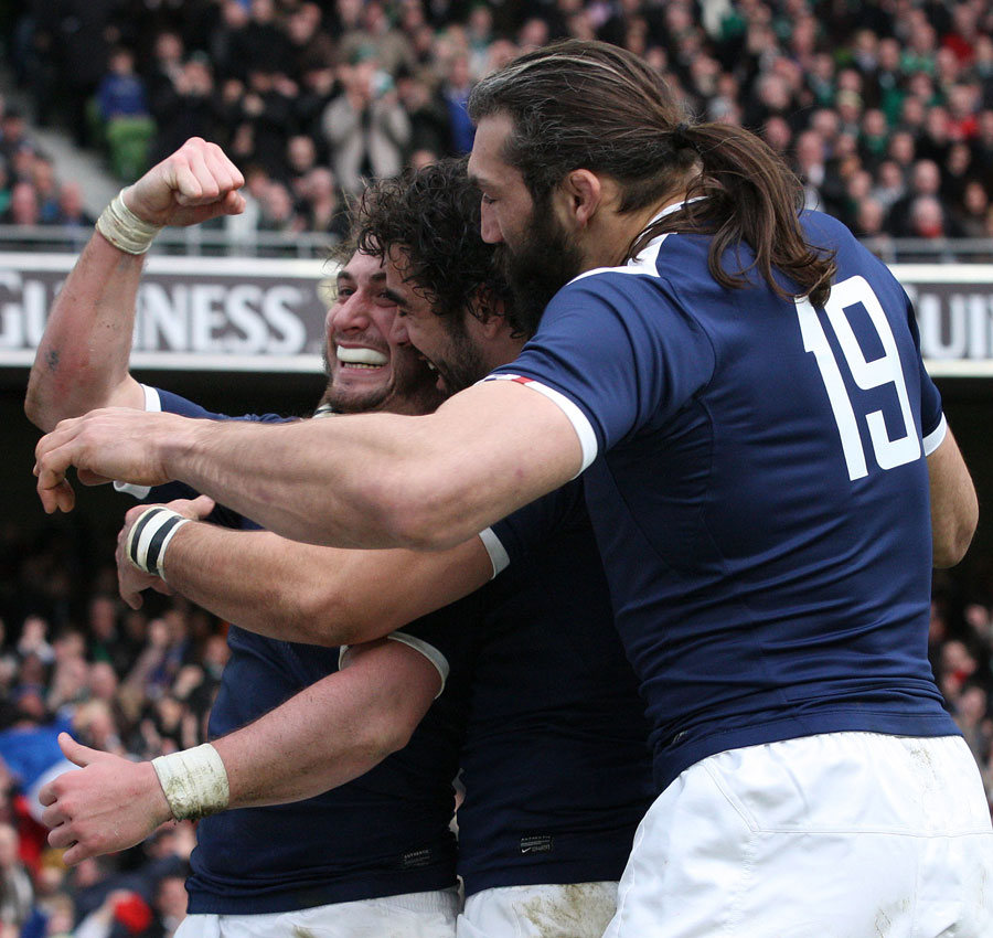 France wing Maxime Medard is mobbed after scoring