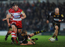 Wasps fly-half Dave Walder loses control of the ball in greasy conditions