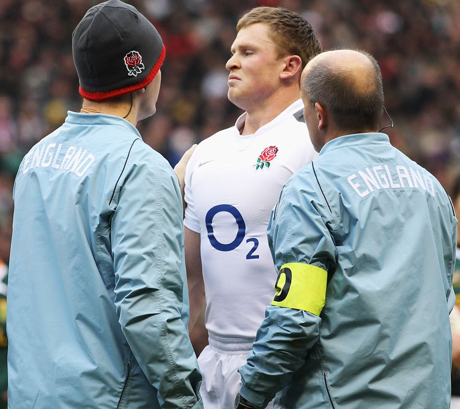 England wing Chris Ashton is examined after taking a bang to the head