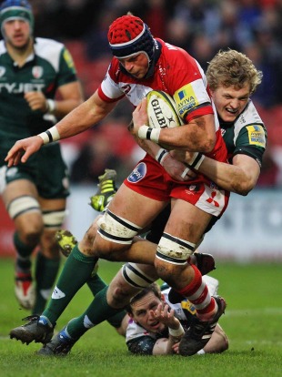 Gloucester's Aex Brown is tackled by London Irish's Jamie Gibson