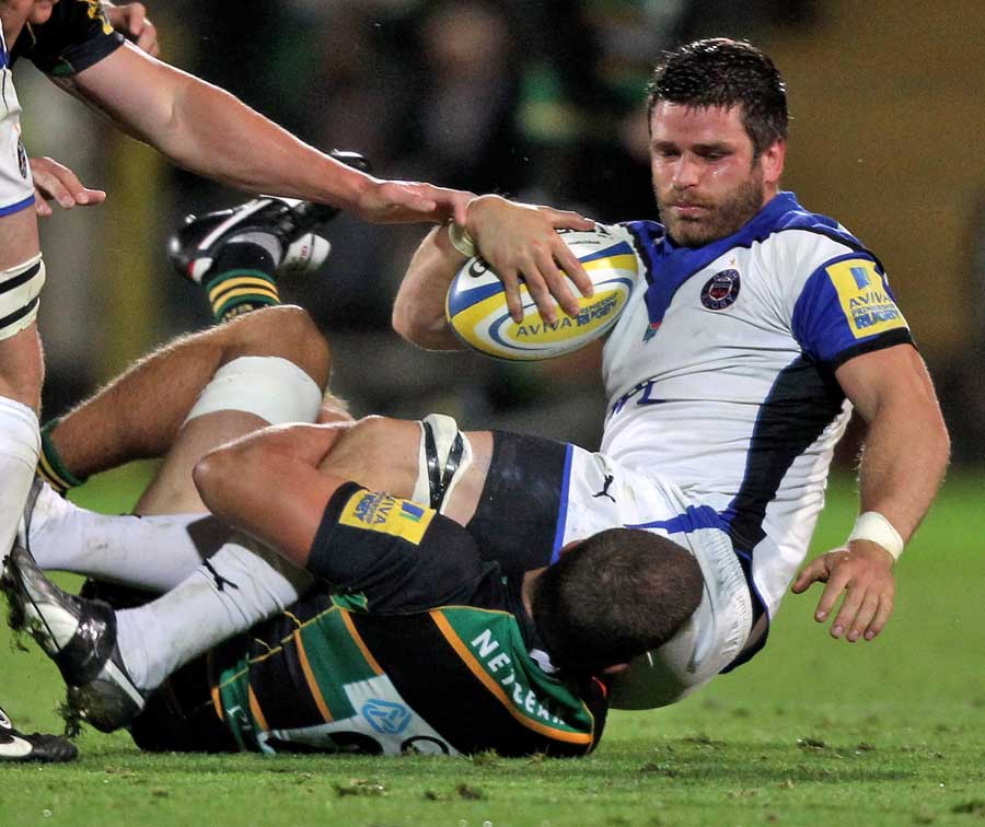 Bath's Luke Watson is tackled by the Northampton defence