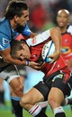 The Lions' Michael Killian is tackled by the Bulls Stephan Dippenaar