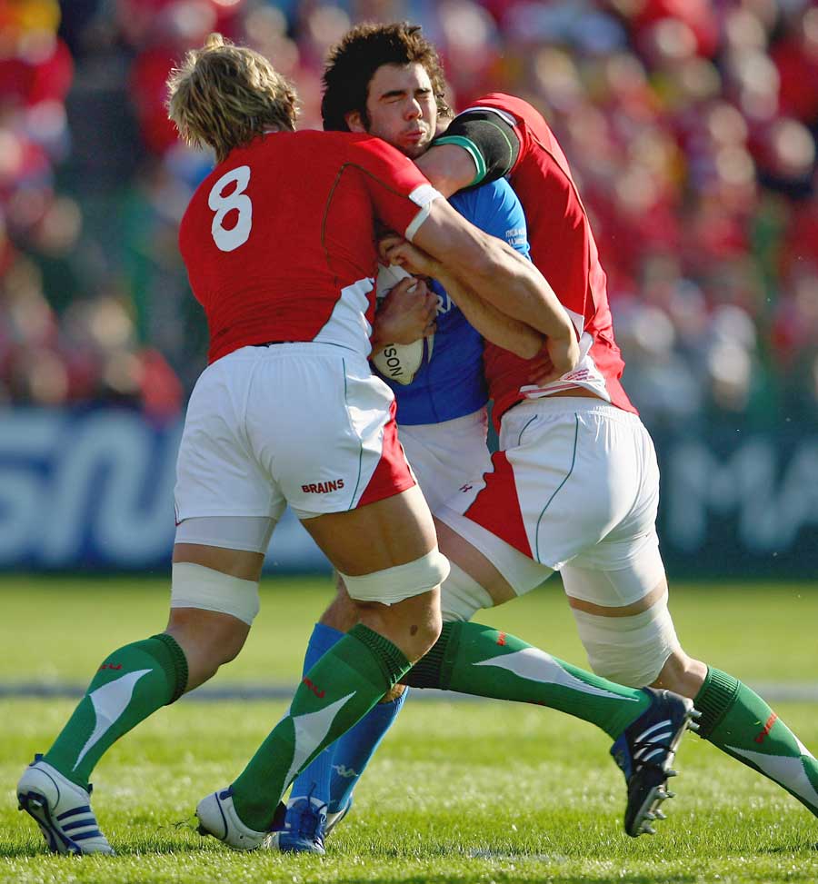 Italy's Alessandro Zanni is wrapped up by the Wales defence
