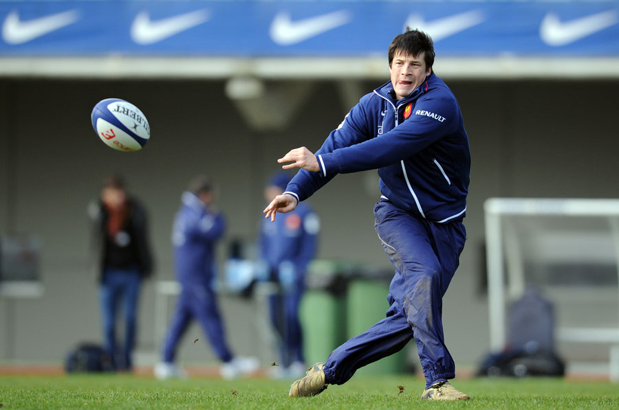 France fly-half Francois Trinh-Duc fires a pass infield