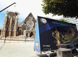 A poster promoting the Rugby World Cup stands in front of Christchurch's Cathedral, Christchurch, New Zealand, February 24, 2011