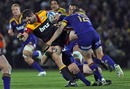 The Chiefs' Stephen Donald is felled by the Highlanders' defence