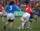 Italy's Sergio Parisse is upended by Dan Lydiate and Sam Warburton