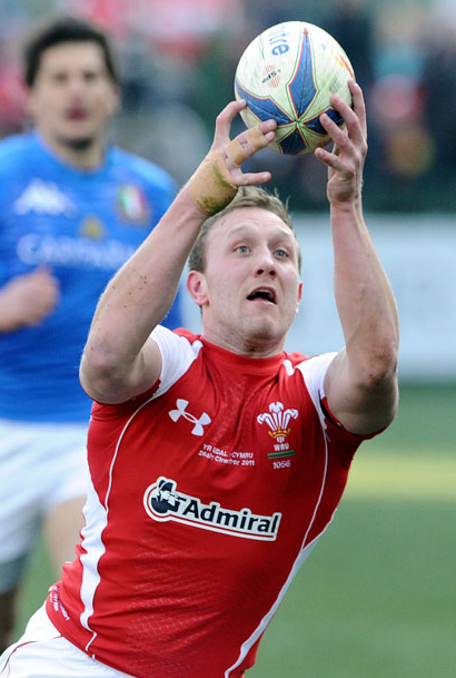 Wales wing Morgan Stoddart struggles to control the ball