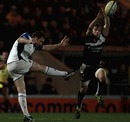 Bath's Butch James clears the ball under intense pressure