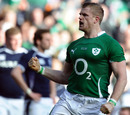 Ireland No.8 Jamie Heaslip celebrates an early try