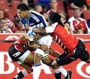 The Blues' Jerome Kaino stretches the Lions' defence