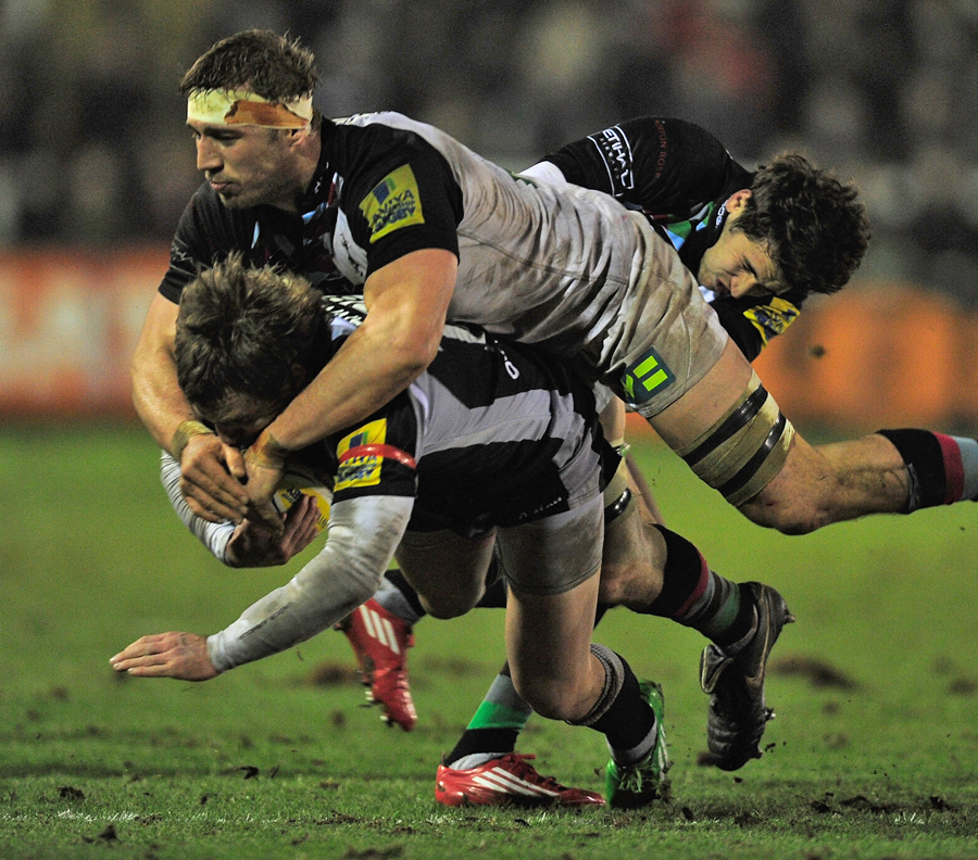 Quins' Chris Robshaw tackles Newcastle's Jeremy Manning