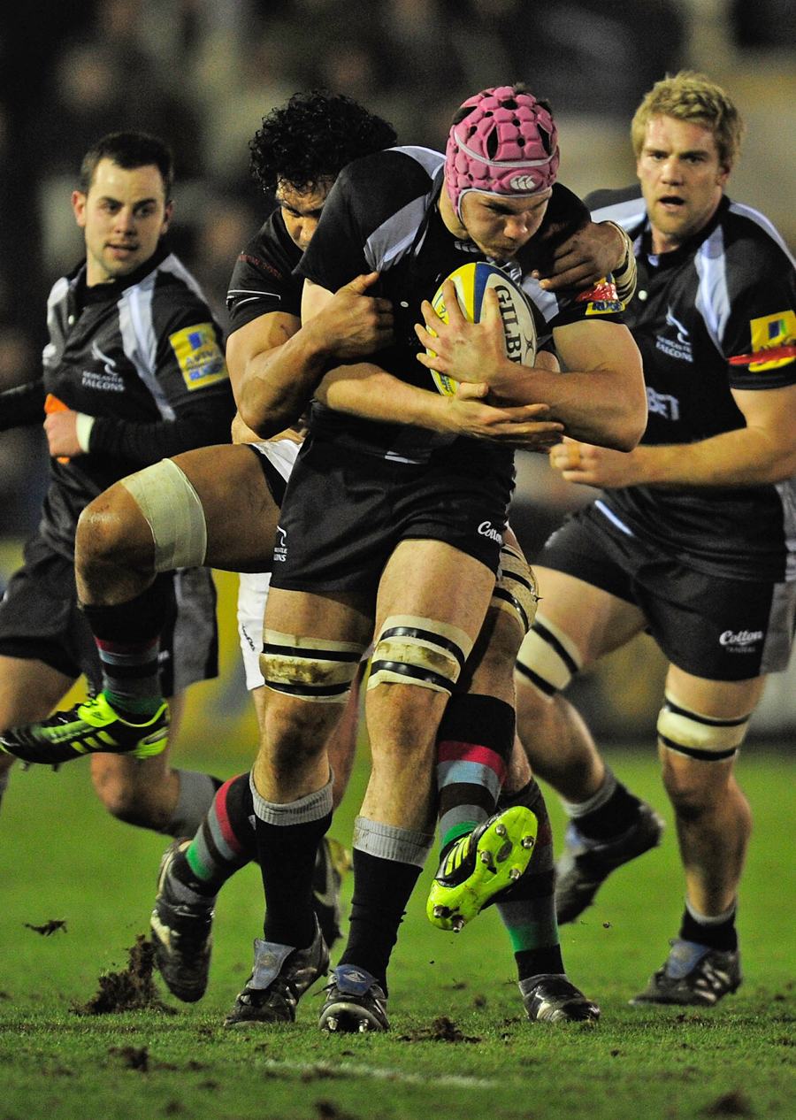 Newcastle's Tim Swinson stretches the Harlequins defence