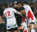 Aironi's Nick Williams is wrapped up by the Ulster defence