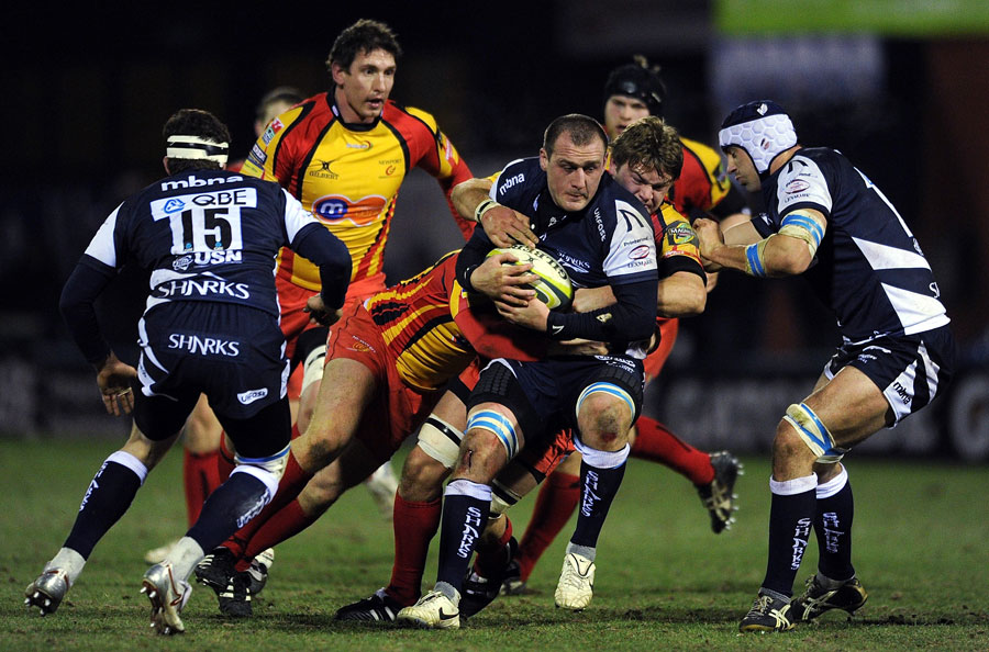 Sale's Carl Fearns is held up by the Dragons defence