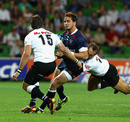 Melbourne Rebels fly-half Danny Cipriani is caught by Stefan Terblanche