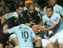 Bayonne flanker Abdellatif Boutaty is wrapped up by the Perpignan defence
