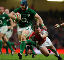 Ireland's Sean O'Brien runs away from Wales' Matthew Rees