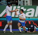 Italy fullback Andrea Masi is congratulated by Carlo Antonio del Fava after his try