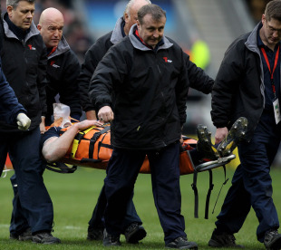 Scotland No.8 Kelly Brown is stretchered off after a blow to his head