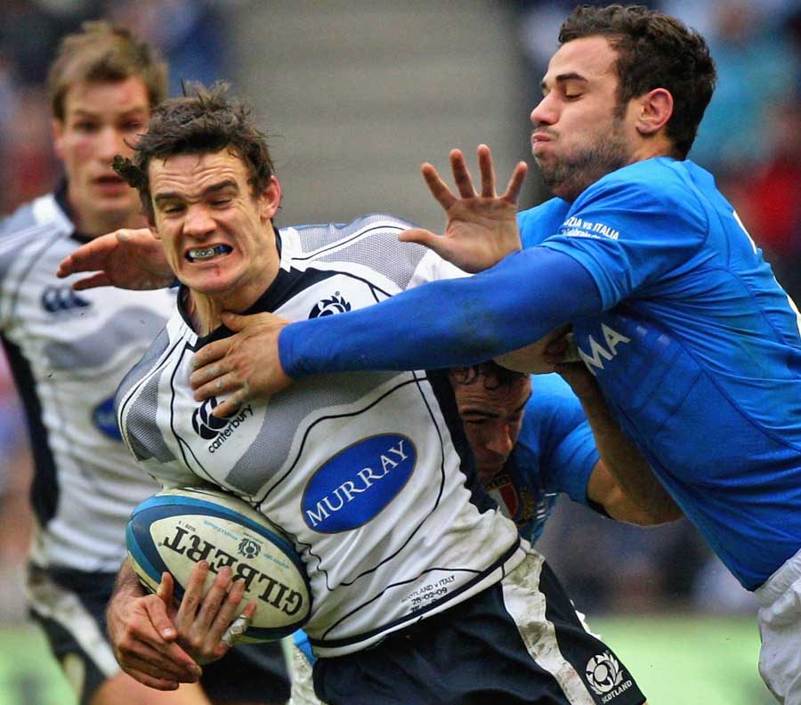 Scotland's Max Evans is tackled by Italy's Andrea Bacchetti 