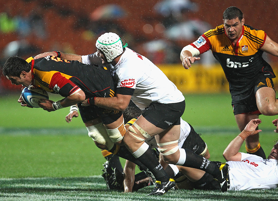 The Chiefs' Isaac Ross is tackled by the Sharks' Steven Sykes