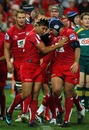 The Reds' Anthony Faingaa is congratulated on a try
