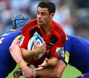 The Crusaders' Dan Carter is wrapped up by the Highlanders' defence
